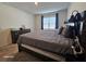 Large bedroom with a dark wood platform bed and dresser at 2672 Harmonia Hammock Rd, Harmony, FL 34773