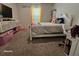 Charming bedroom with a white bed frame and plenty of storage at 2672 Harmonia Hammock Rd, Harmony, FL 34773