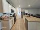 Modern kitchen with granite countertops and white cabinets at 2672 Harmonia Hammock Rd, Harmony, FL 34773