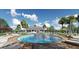 Resort-style pool with lounge chairs and a clubhouse at 2672 Harmonia Hammock Rd, Harmony, FL 34773