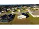 Aerial view showcasing house and surrounding homes at 326 Dinner Lake Ct, Lake Wales, FL 33859