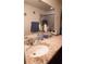 Bathroom vanity with granite countertop and double sinks at 326 Dinner Lake Ct, Lake Wales, FL 33859