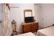 Bright bedroom with twin beds, dresser, and TV at 326 Dinner Lake Ct, Lake Wales, FL 33859