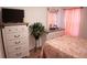 Second bedroom with double closet and TV at 326 Dinner Lake Ct, Lake Wales, FL 33859
