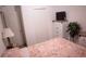 Second bedroom with double closet and TV at 326 Dinner Lake Ct, Lake Wales, FL 33859