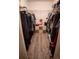 Walk in closet with ample hanging space and shelving at 326 Dinner Lake Ct, Lake Wales, FL 33859