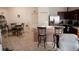 Dining area with a kitchen and breakfast bar in view at 326 Dinner Lake Ct, Lake Wales, FL 33859