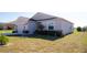 Landscaped front yard with a one-story house and garage at 326 Dinner Lake Ct, Lake Wales, FL 33859