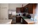 Modern kitchen featuring stainless steel appliances and wood cabinets at 326 Dinner Lake Ct, Lake Wales, FL 33859