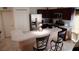 Well-equipped kitchen with stainless steel appliances and breakfast bar at 326 Dinner Lake Ct, Lake Wales, FL 33859