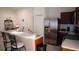 Stainless steel refrigerator and dark wood cabinets in kitchen at 326 Dinner Lake Ct, Lake Wales, FL 33859