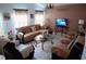 Cozy living room featuring comfortable seating and a large TV at 326 Dinner Lake Ct, Lake Wales, FL 33859