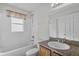 Clean bathroom, shower/tub combo, wood vanity at 3362 Winchester Estates Cir, Lakeland, FL 33810