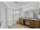 Bathroom with double vanity, shower, and garden tub at 3362 Winchester Estates Cir, Lakeland, FL 33810