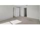 Well-lit bedroom with carpet flooring and access to bathroom at 3362 Winchester Estates Cir, Lakeland, FL 33810