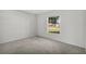 Simple bedroom with carpeted floors and a large window at 3362 Winchester Estates Cir, Lakeland, FL 33810