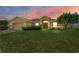 One-story house with a large yard, neutral color scheme, and attached garage at 3362 Winchester Estates Cir, Lakeland, FL 33810