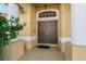Double door entry with columns and a decorative window at 3362 Winchester Estates Cir, Lakeland, FL 33810