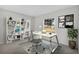 Modern home office with a desk, shelving, and large window at 3362 Winchester Estates Cir, Lakeland, FL 33810