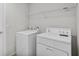 Laundry room with washer, dryer, and overhead shelving at 3362 Winchester Estates Cir, Lakeland, FL 33810