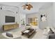 Living room with comfy seating and large TV at 3362 Winchester Estates Cir, Lakeland, FL 33810