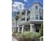 Elegant condominium building with multiple stories and balconies at 6412 Queens Borough Ave # 202, Orlando, FL 32835