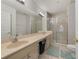 Bathroom with double vanity, large mirror and shower at 701 Westpark Way # 202, Celebration, FL 34747