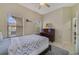 Bright bedroom with double bed, piano, and ample natural light at 701 Westpark Way # 202, Celebration, FL 34747