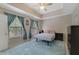 Bright bedroom with a double bed and ceiling fan at 701 Westpark Way # 202, Kissimmee, FL 34747