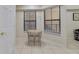 Small breakfast nook with a table and two chairs by window at 701 Westpark Way # 202, Celebration, FL 34747
