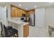 Modern kitchen with stainless steel appliances and wood cabinets at 701 Westpark Way # 202, Celebration, FL 34747