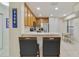 Modern kitchen with stainless steel appliances and wood cabinets at 701 Westpark Way # 202, Celebration, FL 34747