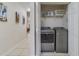 Convenient laundry room with washer and dryer in a closet at 701 Westpark Way # 202, Celebration, FL 34747