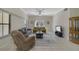 Bright living room with tile floors, comfy furniture, and large windows at 701 Westpark Way # 202, Celebration, FL 34747
