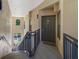 Clean, well-lit stairwell with dark metal railings leading to a condo entrance at 701 Westpark Way # 202, Celebration, FL 34747