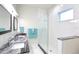 Clean bathroom with a large shower and granite vanity at 803 E 11Th Ave, New Smyrna Beach, FL 32169
