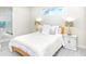 Bright bedroom with a queen-size bed and ensuite bathroom at 803 E 11Th Ave, New Smyrna Beach, FL 32169