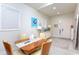 Small dining area with vintage table and chairs at 803 E 11Th Ave, New Smyrna Beach, FL 32169