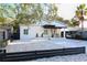 Contemporary home with a clean design, modern fence, and gravel landscaping at 803 E 11Th Ave, New Smyrna Beach, FL 32169