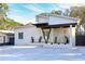 Stylish home features a covered entryway and modern architectural design at 803 E 11Th Ave, New Smyrna Beach, FL 32169