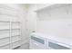 Bright walk-in closet with shelving and drawers at 803 E 11Th Ave, New Smyrna Beach, FL 32169