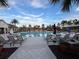 Community pool with plenty of lounge chairs at 8610 Tallfield Ave, Orlando, FL 32832