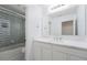Modern bathroom with white cabinets and mosaic tile at 9111 Outlook Rock Trl, Windermere, FL 34786