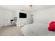 Main bedroom with large TV, work desk and red accent pillows at 9111 Outlook Rock Trl, Windermere, FL 34786