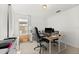Home office with large desk and comfortable chair at 9111 Outlook Rock Trl, Windermere, FL 34786