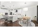 Modern kitchen with white cabinets, island, and breakfast nook at 9111 Outlook Rock Trl, Windermere, FL 34786