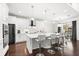 Modern kitchen with white cabinets, stainless steel appliances and breakfast bar at 9111 Outlook Rock Trl, Windermere, FL 34786