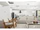 Open living space with comfortable seating and a view of the kitchen at 9111 Outlook Rock Trl, Windermere, FL 34786