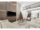 Living room features a large TV, modern decor, and a Christmas tree at 9111 Outlook Rock Trl, Windermere, FL 34786