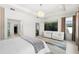 Bright main bedroom with sitting area and ensuite bathroom at 9111 Outlook Rock Trl, Windermere, FL 34786